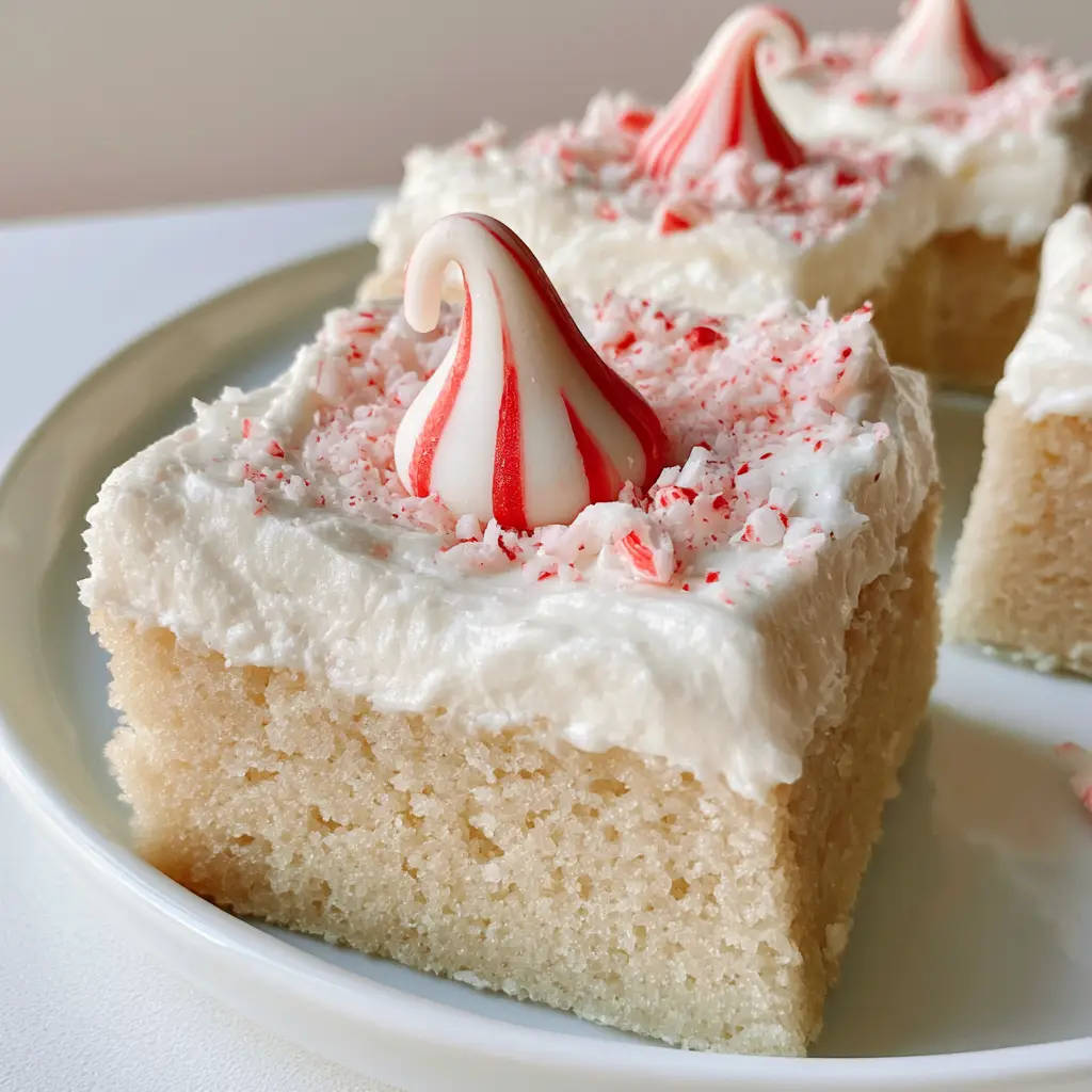 Peppermint Sugar Cookie Bars with Candy Cane Kisses 1 Bright and clean photo of holiday sugar cookie bars with crushed candy cane garnish.