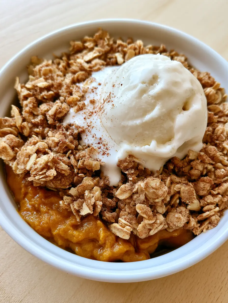 The Ultimate Pumpkin Crisp Recipe with Spiced Custard and Oat Streusel 4 Overhead view of a Pumpkin Crisp Recipe showing the golden-brown toasted oat streusel and spiced custard base.